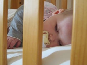 baby asleep in cot