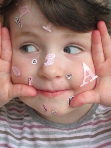 child's face with letters