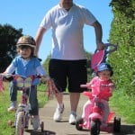 girls going for bike ride with dad