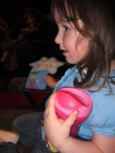 Girl at Dora the Explorer concert with her Tommee Tippee discovera cup